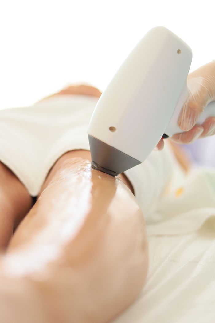 Mastering the First Impression: Your intriguing post title goes here Close-up of laser hair removal on woman's leg in professional spa setting.