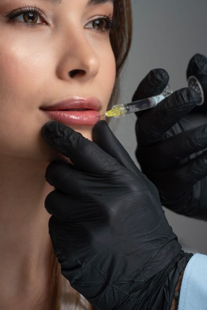pexels photo 34775443 Detailed image of a cosmetic lip injection being administered by a professional.